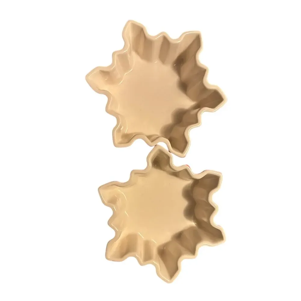Crate & Barrel pair of red and white ceramic snowflake shaped bowls